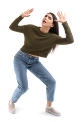 Scared young woman on white background