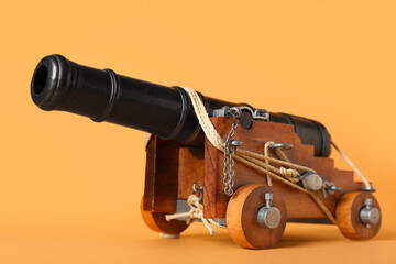 Toy model of cannon on orange background