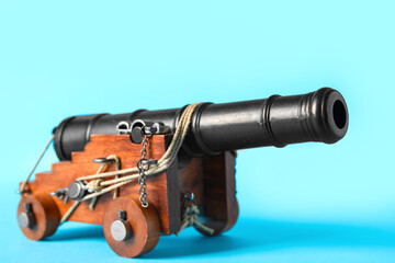 Toy model of cannon on blue background