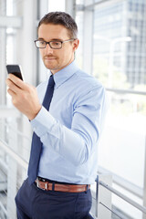 Fototapeta premium Corporate, planning or business man with phone for invest strategy, finance growth or financial review. Manager thinking in office building for social media, data analysis or economy data research