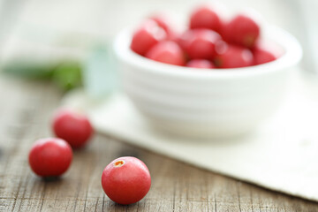 Jamaican cherry on a wooden floor. Calabura, Jam tree, Malayan Cherry, West Indian Cherry