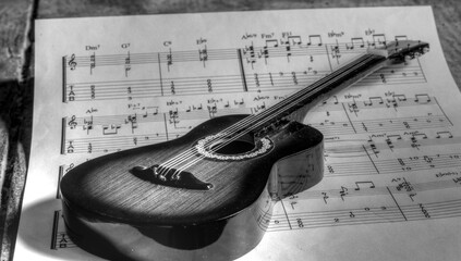 a guitar and musical notes accompany us throughout life