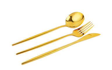 Golden cutlery on white background