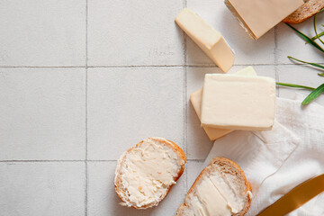 Sandwiches with processed cheese and herbs on white tile background