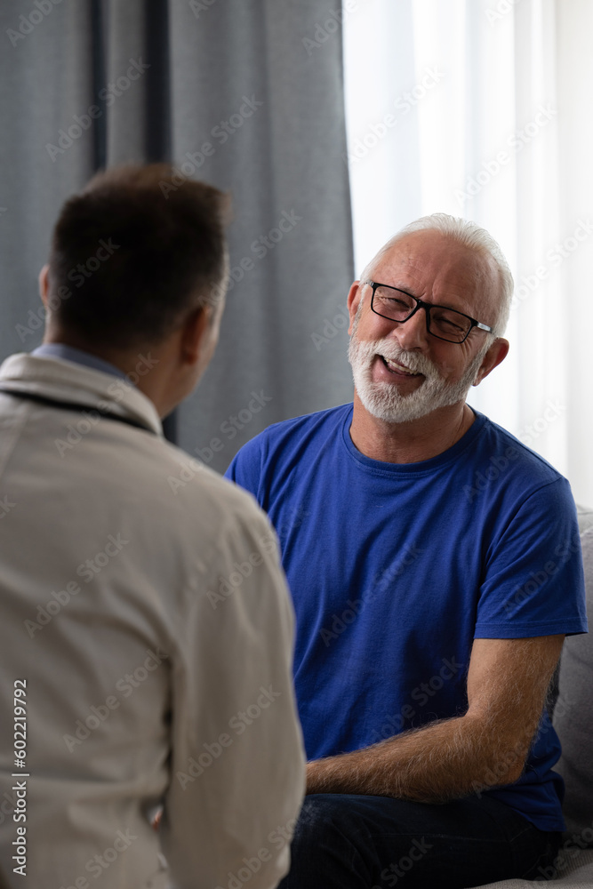 Wall mural healthy smiling senior patient feeling cheerful about good news at medical consultation. happy eldel