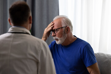 Doctor physician talking to distressed, sad senior patient having bad diagnosis, disease or health problem. Elderly medical health care concept - 602219798