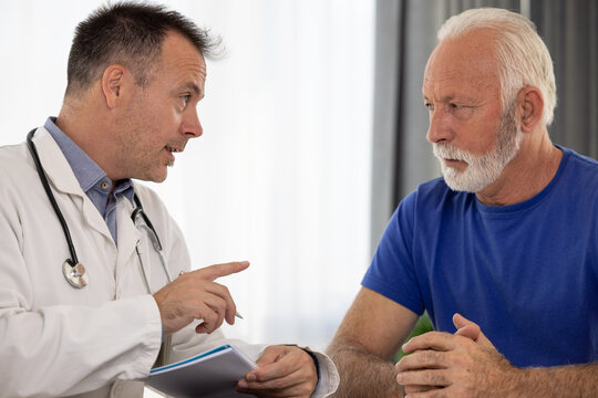 Doctor physician talking and consulting senior male patient. Elderly medical health care concept
