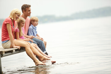 Water, lake and holiday with family with foot in water for lifestyle with mockup during summer. Kids, child and happy at river for adventure and space for vacation with sunshine for love and travel.