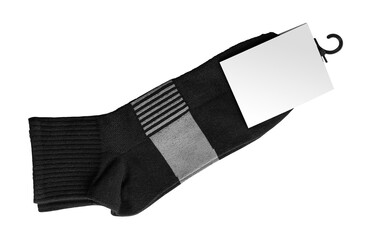 New socks on a transparent background. Socks in black with a blank label for your design. Isolated object