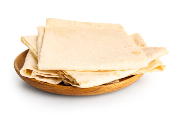 Plate with fresh thin lavash on white background