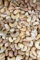 Natural, unprocessed cashew nuts image makes versatile backdrop for your food-related projects. - 602221163
