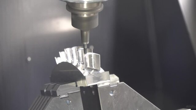 The 5-axis machining center cutting the water turbine blade part with solid ball end mill tool.