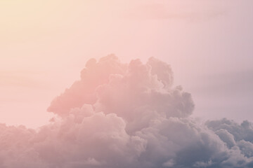 Fluffy clouds against the backdrop of the setting sun