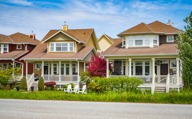 Perfect neighborhood. Houses in suburb at Spring in the north America. Real Estate Exterior Front Houses on a sunny day