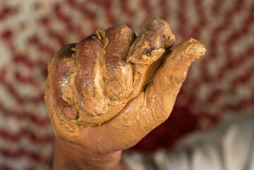 Dirty hands from traces of clay pottery and Close up hands of the traditional pottery making in the old way clay

