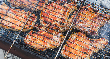 Barbecue with tasty grilled meat on grill, closeup. Barbeque party