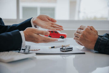 The young businessman made a lease for a new car in the office of a car dealer and received the keys after the contract was completed. The concept of a car purchase contract