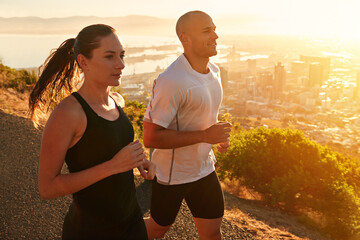 Sunrise, training and running couple as workout or morning exercise for health and wellness...