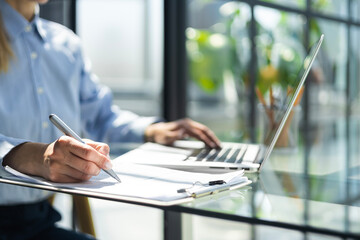 Image of business woman hands taking business notes at office.