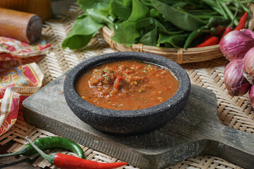 A famous condiment in Malaysia is 'Sambal Belacan' and in Indonesia  is 'Sambal Terasi'