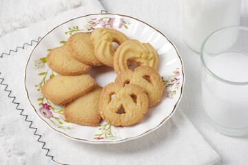 Butter Cookies assortment of four whole pretzels, round and rectangular shortbread biscuits with sugar. Traditional British dessert snack or breakfast food