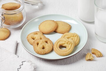 Butter Cookies assortment of four whole pretzels, round and rectangular shortbread biscuits with sugar. Traditional British dessert snack or breakfast food