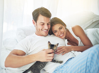 Obraz na płótnie Canvas Bedroom love, pet cat and happy couple relax for morning peace, calm and bonding quality time together in Toronto Canada. Flare, animal kitten and romantic people smile in home bed for Valentines Day