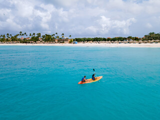 Couple Kayaking in the Ocean on Vacation Aruba Caribbean Sea