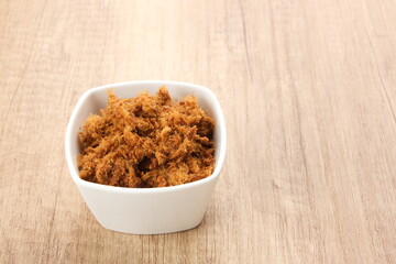Abon Sapi, dried shredded beef or beef floss, served in bowl.
