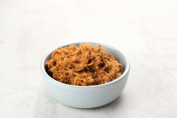 Abon Sapi, dried shredded beef or beef floss, served in bowl.
