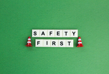 letters of the alphabet with the word safety first. the concept of prioritizing safety in a matter...
