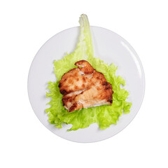 Meat cutlet with stuffing on a lettuce leaf, isolated on a white background. Plate with cutlet in Kiev, Ukraine