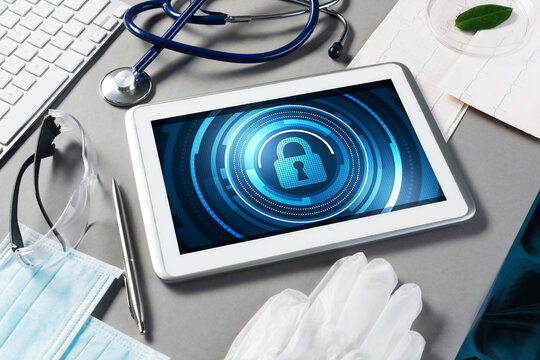 Web security and technology concept with tablet pc on table