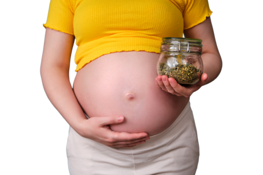 A pregnant woman holds a jar of green tea in her hand, isolated on a white background