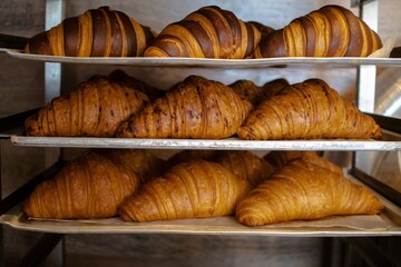 baking process of tasty delicious french croissants, brown crusty croissant for breakfast, pastry, dough, sweet snack 