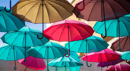 colored umbrellas to shelter from the rain and the sun