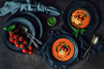 Fresh tomato soup with roasted tomatoes, feta cheese and basil pesto