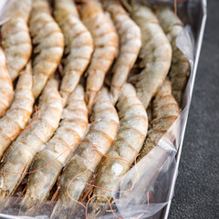 shrimp gambas raw frozen seafood prawn meal food snack pescatarian diet on the table copy space food background rustic top view 