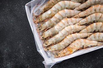 shrimp gambas raw frozen seafood prawn meal food snack pescatarian diet on the table copy space food background rustic top view 
