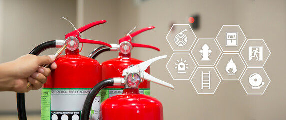 Fire extinguisher has hand engineer checking pressure gauges and prevent icons to prepare fire equipment for protection in emergency case and safety or rescue and alarm system training concept. - obrazy, fototapety, plakaty