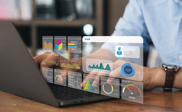 Business strategy concept for the development of the organization. Businessman use laptops to work on virtual smart digital screens, Analyze statistical Marketing data,Data management
