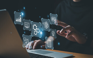 Business person dress in formal suit holding an icon that show the component of Business that do digital transformation for industrial or manufacturing vertical