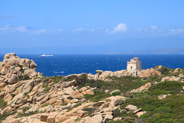 Fototapeta na wymiar Old Lighthouse of Capo Testa (Faro di Capo Testa) at Sardinia 