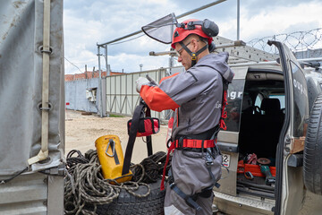 Fototapeta premium Rope access is a high-risk job. A man works on ropes.