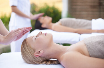 Reiki, facial flow and women at spa for health, wellness and chakra energy healing with luxury stress relief treatment. Beauty salon, skin care and woman in holistic massage on face for calm aura.