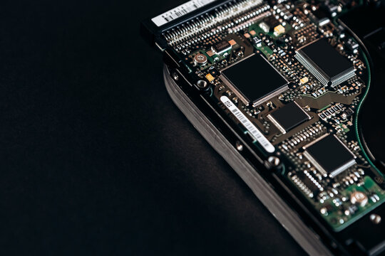 Computer disassembled HDD hard drive data disc SSD, backup part of the PC or laptop. Recovery, fixing technology maintenance work, access file. Engineer profession repairman