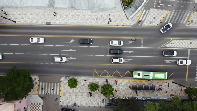 Bus Stop Aerial Shoot.Traffic in the city. Bus going in the bus line