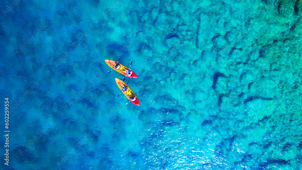 Poster kayaking. aerial view of floating kayaks and people on blue sea at sunny day. travel and active life