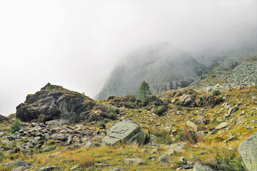 panorama of high mountains with clouds on the horizon