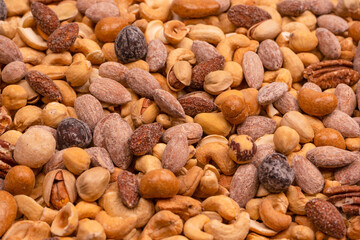 A group of almonds, pistachios, walnuts, macadamia, cashews.